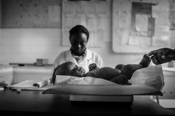 Baby being weighted at Malhangalene Health Center, Mozambique.